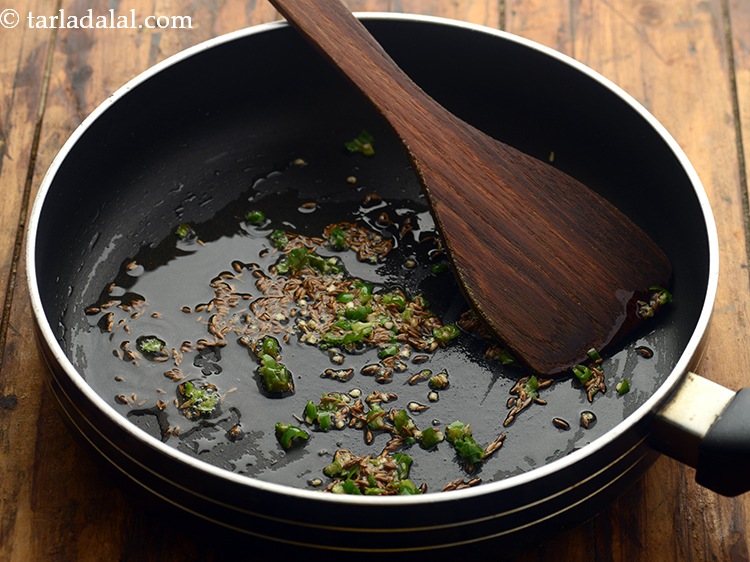 Step 15 – When the seeds crackle, add the green chillies and saut&eacute; on a medium flame for …