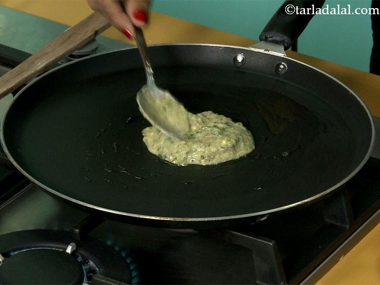 Step 18 – Pour a portion of the batter on the tava (griddle).