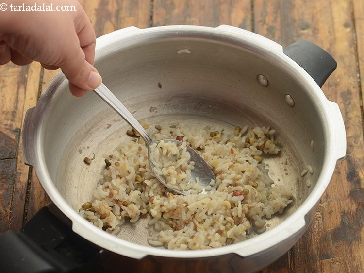 Step 25 – Mash the <strong>healthy sprouts khichdi for toddlers</strong> slightly with the back of a spoon or …