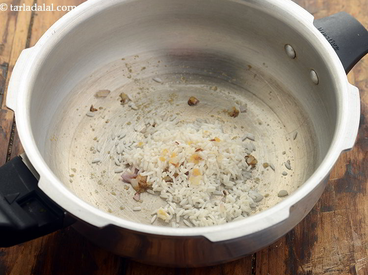 Step 17 – Add the washed rice to the pressure cooker.