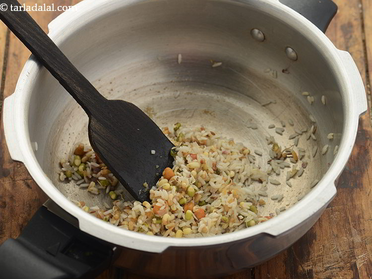 Step 19 – Saut&eacute; the rice and sprouts for 30 seconds as well.