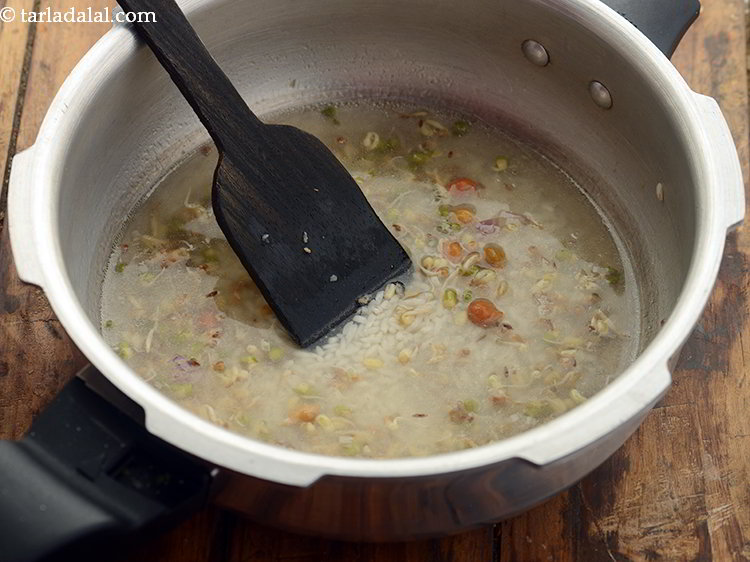 Step 22 – Mix all the ingredients for <strong>mixed sprouts khichdi for babies</strong> with a ladle.