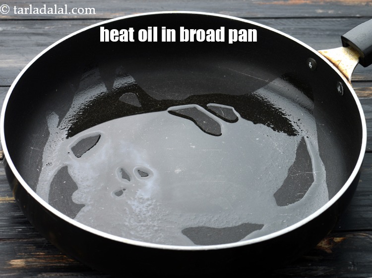 Step 7 – Heat 2 tsp&nbsp;<a href="https://www.tarladalal.com/glossary-oil-671i">oil</a> in a broad non-stick pan.