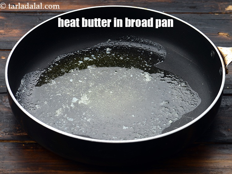 Step 12 – To make baked beans filling, heat 1 tbsp&nbsp;<a href="https://www.tarladalal.com/glossary-butter-makhan-233i">butter</a>&nbsp;in a broad non-stick pan.