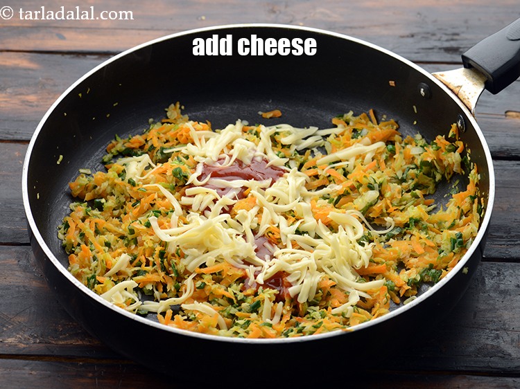 Step 12 – Add 1/4 cup&nbsp;<a href="https://www.tarladalal.com/glossary-grated-processed-cheese-868i">grated processed cheese</a>.&nbsp;