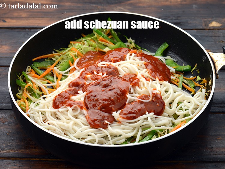 Step 26 – Add 1/2 cup&nbsp;<a href="https://www.tarladalal.com/glossary-schezwan-sauce-schezuan-sauce-1872i">schezuan sauce</a>.&nbsp;