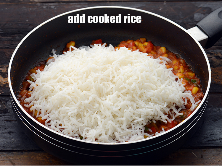 Step 19 – Add 2 cups&nbsp;<a href="https://www.tarladalal.com/glossary-soaked-and-cooked-long-grain-rice--1904i">cooked long grained basmati rice (chawal)</a>.