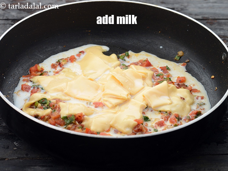 Step 14 – Add 1/4 cup&nbsp;<a href="https://www.tarladalal.com/glossary-milk-doodh-full-cream-milk-514i">milk</a>.&nbsp;