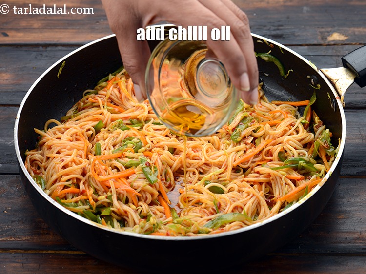 Step 28 – Add 1 tbsp&nbsp;chilli&nbsp;<a href="https://www.tarladalal.com/glossary-oil-671i">oil</a>.&nbsp;