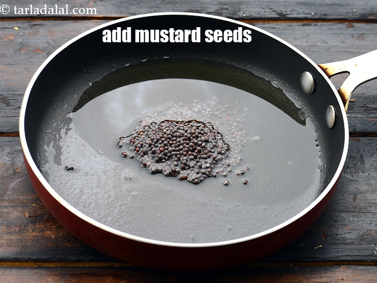 Step 22 – Add 1 tsp&nbsp;<a href="https://www.tarladalal.com/glossary-mustard-seeds-sarson-rai-sarson-ke-beej-525i">mustard seeds ( rai / sarson)</a>.