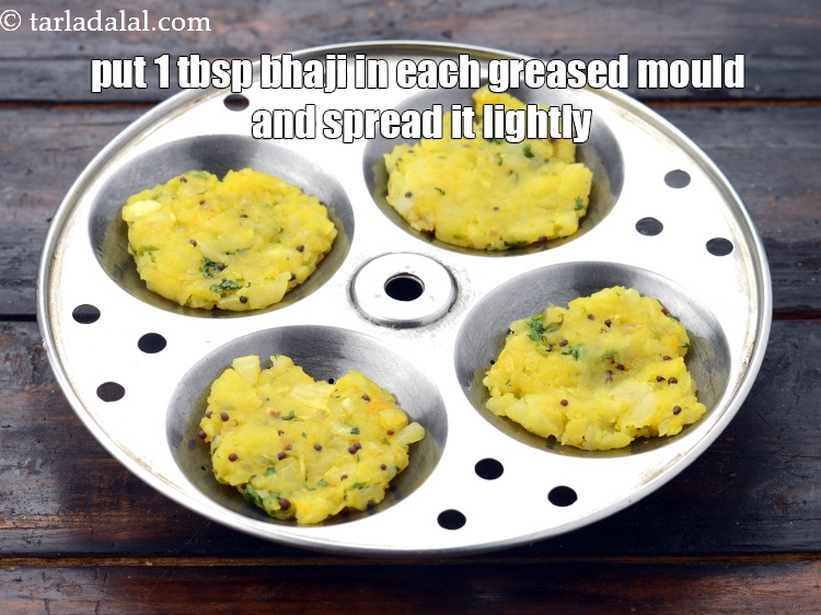 Step 20 – Put 1 tbsp of the bhaji in each greased mould and spread it lightly.