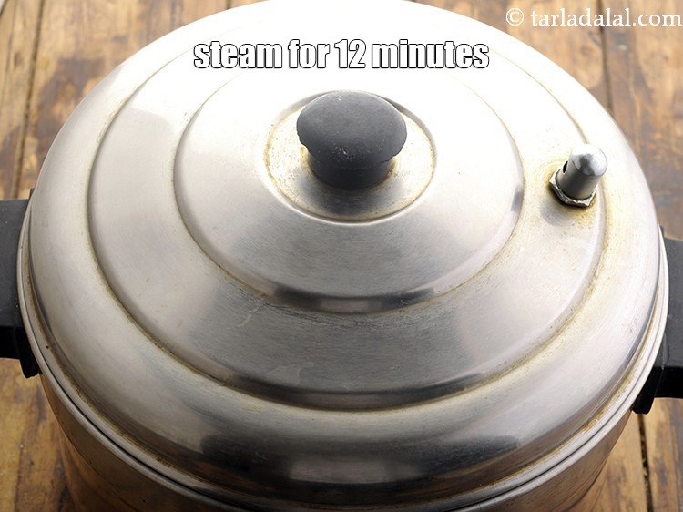 Step 22 – Steam in a steamer for 12 minutes or till the idlis are cooked.