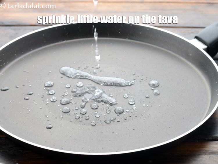 Step 21 – Sprinkle a little water on the tava (griddle). The temperature of the tawa should not …