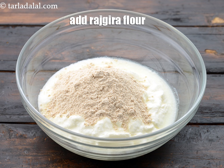 Step 5 – Add 1/4 cup&nbsp;<a href="https://www.tarladalal.com/glossary-rajgira-flour-ramadana-flour-amaranth-flour-rajgira-ka-atta-1297i">rajgira (amaranth) flour</a>.