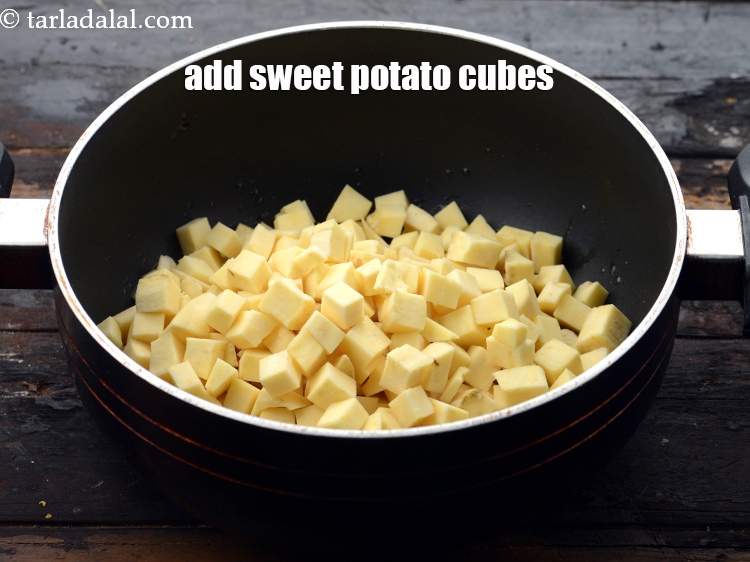 Step 7 – Add 2 cups&nbsp;<a href="https://www.tarladalal.com/glossary-sweet-potato-cubes-1120i">sweet potato (shakarkand) cubes</a>.&nbsp;