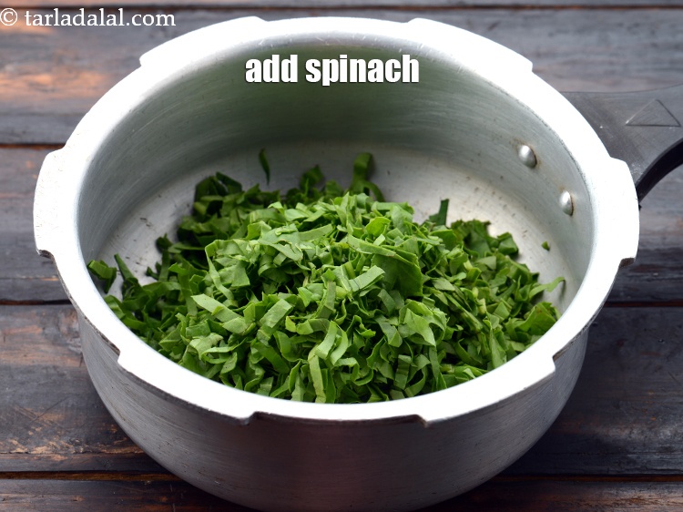 Step 4 – Add 1 1/2 cups&nbsp;<a href="https://www.tarladalal.com/glossary-shredded-spinach-777i">shredded spinach (palak)</a>.