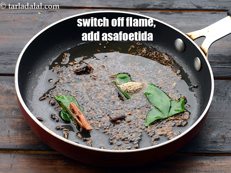 Step 28 – Switch off the flame, add 1/4 tsp&nbsp;<a href="https://www.tarladalal.com/glossary-asafoetida-hing-113i">asafoetida (hing)</a>.