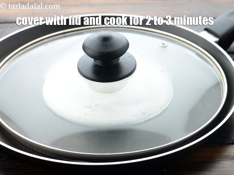 Step 33 – Covering the set dosa while cooking makes it easier to cook and cooks well.