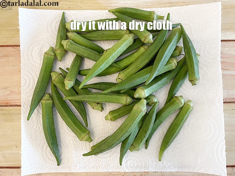 Step 25 – Remember the bhindi should be completely dry before adding spices, else it might splutter in …