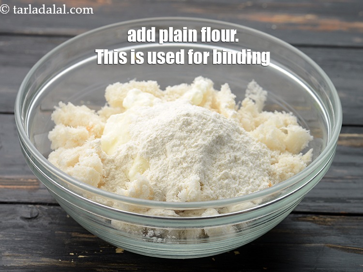 Step 7 – Add 2 tbsp&nbsp;<a href="https://www.tarladalal.com/glossary-plain-flour-maida-188i">plain flour (maida)</a>. This is used for binding.&nbsp;