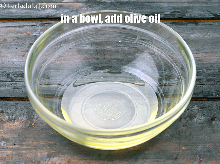Step 7 – In a bowl, add 1 tbsp&nbsp;<a href="https://www.tarladalal.com/glossary-olive-oil-451i">olive oil</a>.