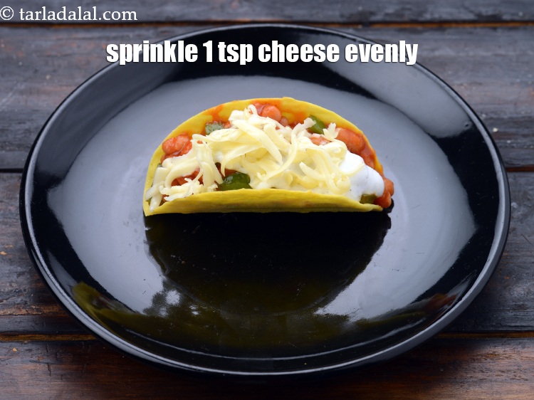 Step 24 – Finally sprinkle 1 tsp&nbsp;<a href="https://www.tarladalal.com/glossary-grated-processed-cheese-868i">grated processed cheese</a> evenly.&nbsp;