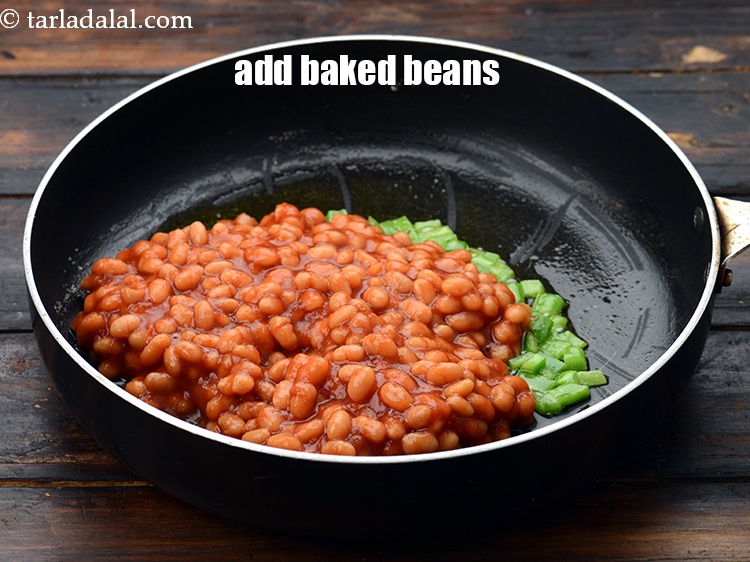 Step 15 – Add 1 1/2 cups&nbsp;<a href="https://www.tarladalal.com/glossary-baked-beans-177i">baked beans</a>.&nbsp;