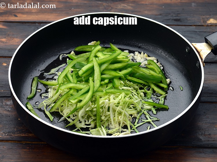 Step 20 – Add 3/4 cup&nbsp;thinly&nbsp;<a href="https://www.tarladalal.com/glossary-sliced-capsicum-165i">sliced capsicum</a>.&nbsp;
