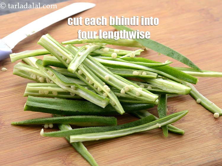 Step 8 – Cut each bhindi into four lengthwise. If the bhindi is small, then cut only into …