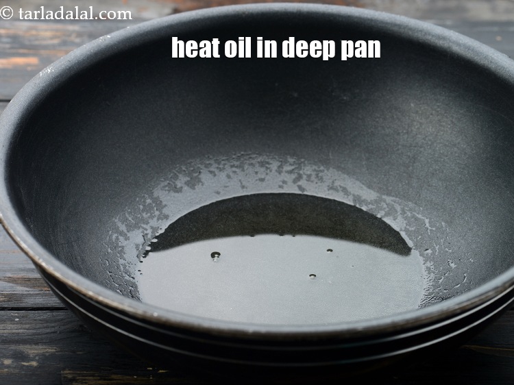 Step 24 – Heat 2 tbsp <a href="https://www.tarladalal.com/glossary-oil-671i">oil</a>&nbsp;in a deep non-stick pan.