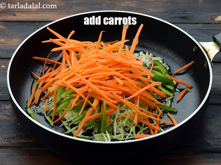 Step 21 – Add 1/2 cup&nbsp;thinly&nbsp;<a href="https://www.tarladalal.com/glossary-sliced-carrots-748i">sliced carrots</a>.&nbsp;