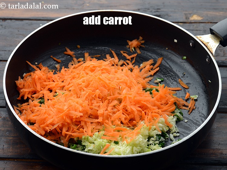 Step 8 – Add 1 cup&nbsp;<a href="https://www.tarladalal.com/glossary-grated-carrot-816i">grated carrot</a>.&nbsp;