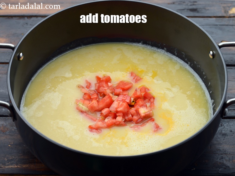 Step 15 – Add 1/4 cup&nbsp;<a href="https://www.tarladalal.com/glossary-chopped-tomatoes-779i">chopped tomatoes</a>.