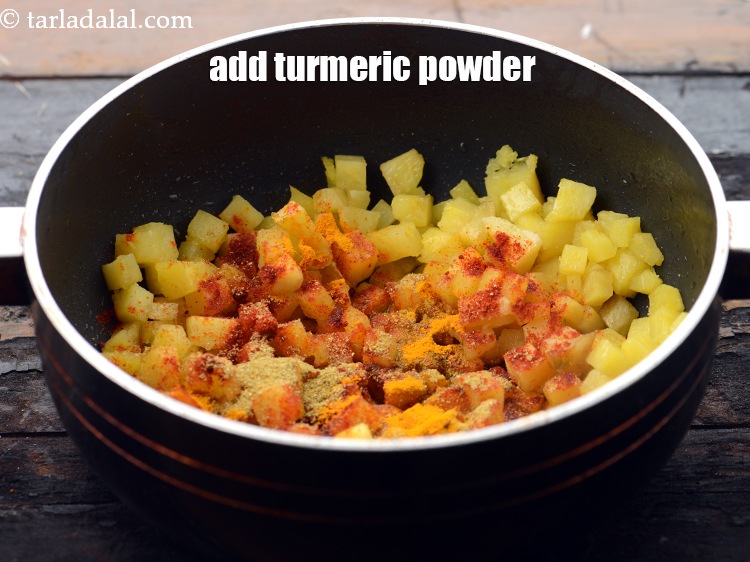 Step 12 – Add 1/4 tsp&nbsp;<a href="https://www.tarladalal.com/glossary-turmeric-powder-haldi-645i">turmeric powder (haldi)</a>.&nbsp;