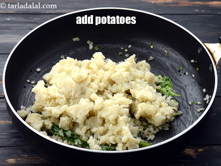 Step 13 – Add 1 1/2 cups&nbsp;<a href="https://www.tarladalal.com/glossary-boiled-and-mashed-potatoes-1831i">boiled , peeled and mashed potatoes</a>.&nbsp;