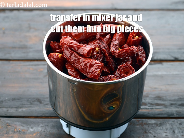 Step 10 – Transfer the soaked and drained red chillies into a small mixer jar and cut them …
