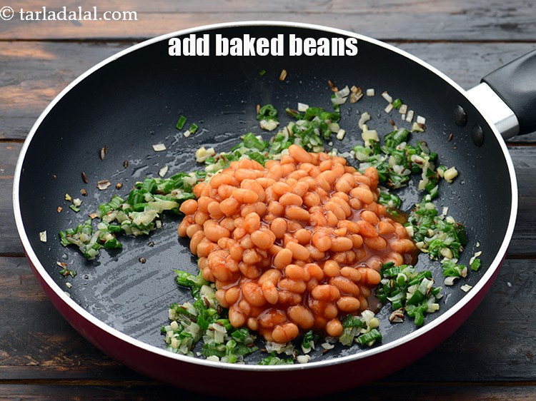 Step 10 – Add 3/4 cup&nbsp;<a href="https://www.tarladalal.com/glossary-baked-beans-177i">baked beans</a>.