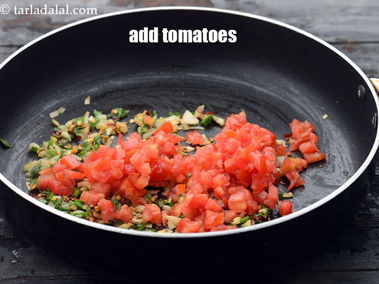Step 10 – Add 1/2 cup&nbsp;finely&nbsp;<a href="https://www.tarladalal.com/glossary-chopped-tomatoes-779i">chopped tomatoes</a>.&nbsp;