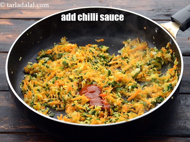 Step 10 – Add 1/2 tbsp&nbsp;<a href="https://www.tarladalal.com/glossary-red-chilli-sauce-lal-chilli-sauce-810i">chilli sauce</a>.&nbsp;