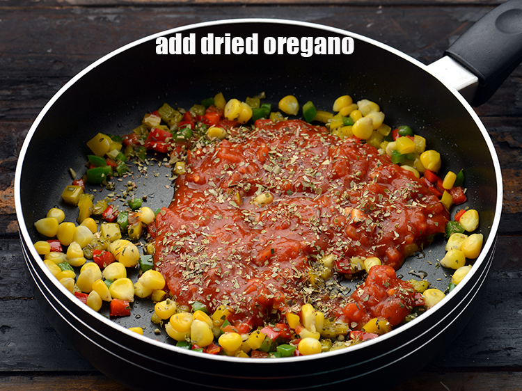Step 16 – Add 1 tsp&nbsp;<a href="https://www.tarladalal.com/glossary-dried-oregano-268i">dried oregano</a>.