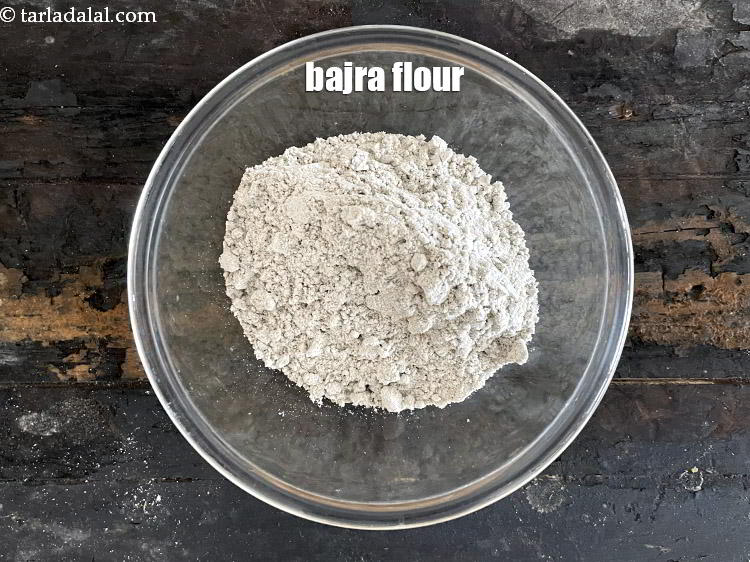 Step 8 – In a bowl put&nbsp;<meta charset="UTF-8" />1 cup&nbsp;<a href="glossary-bajra-flour-bajra-ka-atta-bajre-ka-atta-176i">bajra (black millet) flour</a>.