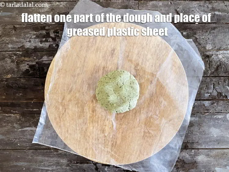 Step 16 – Flatten one part of the dough and place over the rolling board.