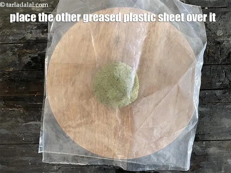 Step 17 – Place the other greased sheet over it.