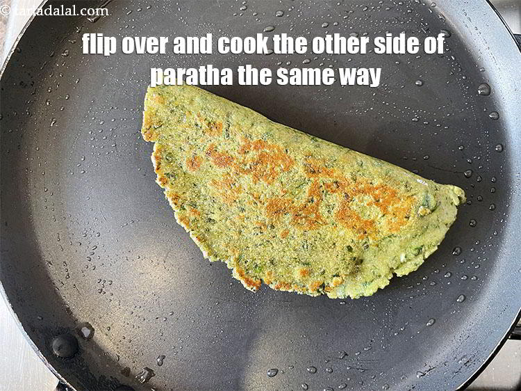 Step 33 – Flip over and cook the other side of the paratha the same way.