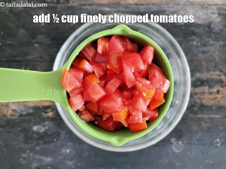 Step 24 – Add&nbsp;<meta charset="UTF-8" />1/2 cup finely chopped&nbsp;<a href="glossary-tomatoes-tamatar-639i">tomato</a>.