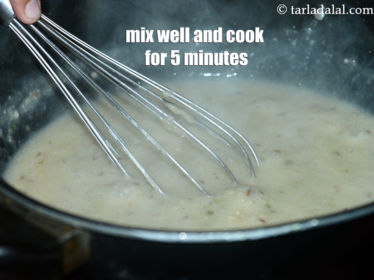 Step 10 – Mix well and cook on a medium flame for 5 minutes, while stirring continuously with …