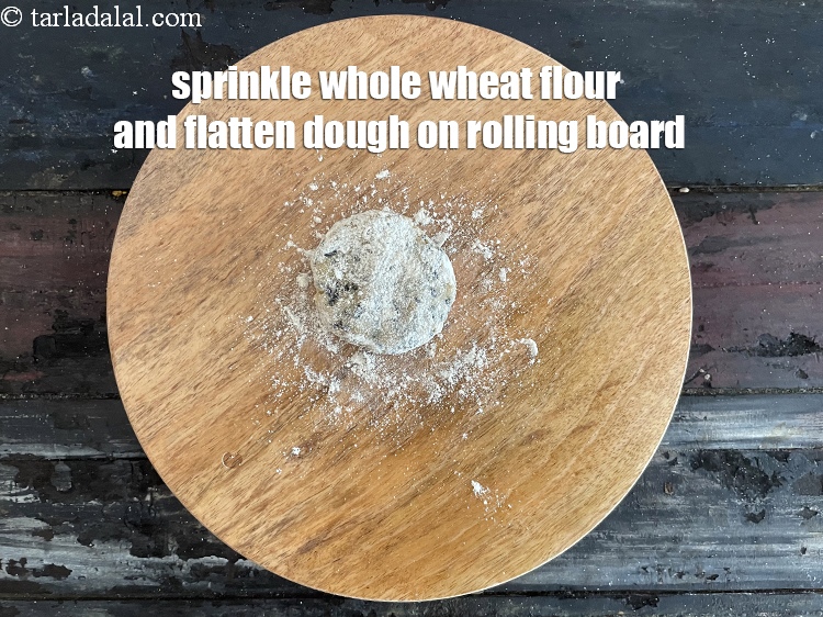 Step 11 – <meta charset="UTF-8" />Sprinkle a little&nbsp;<a href="https://www.tarladalal.com/glossary-whole-wheat-flour-gehun-ka-atta-gehun-ka-aata-429i">whole wheat flour (gehun ka atta)</a>&nbsp; on the rolling surface.&nbsp;Flatten …