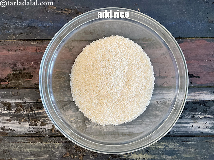 Step 3 – Put&nbsp;1 1/2 cups rice in a glass bowl.