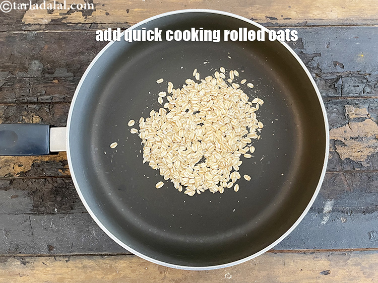 Step 23 – In a broad non stick pan put&nbsp;1/4 cup&nbsp;<a href="https://www.tarladalal.com/glossary-quick-cooking-rolled-oats-rolled-oats-547i">quick cooking rolled oats</a>.
