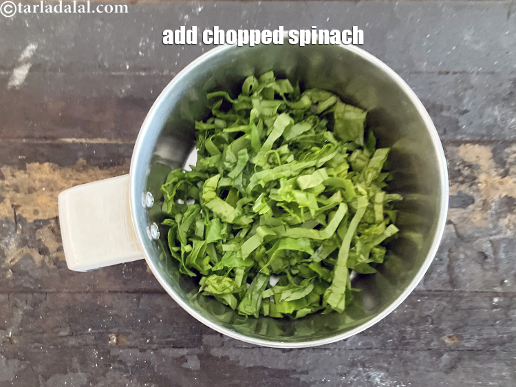 Step 3 – In a mixer put&nbsp;<meta charset="UTF-8" />1 1/2 cups&nbsp;roughly&nbsp;<a href="glossary-chopped-spinach-780i">chopped spinach (palak)</a>.